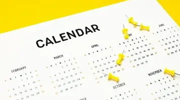 A closeup of a desk calendar used for planning site visits